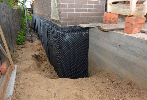 SJ Waterproofing Pros technician performing targeted Exterior Waterproofing assessment in Bannister, MI